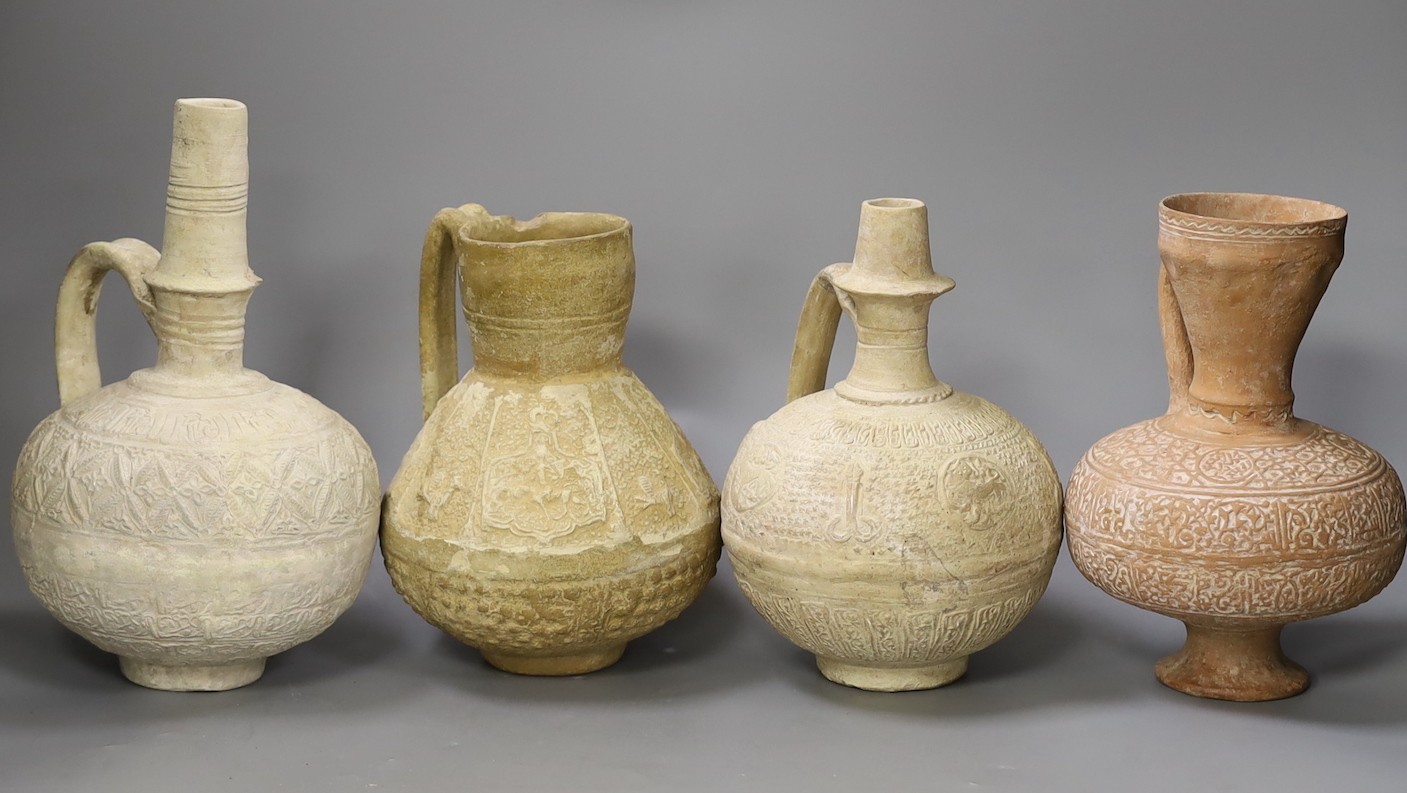 Four Islamic terracotta jugs, Middle Eastern possibly, 12th century, tallest 26cm